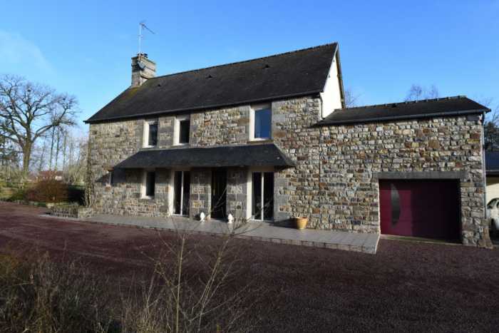 AHIN-SP-001500 Nr Mortain 50140 Immaculate detached 3 bedroom stone house with just under an acre of garden